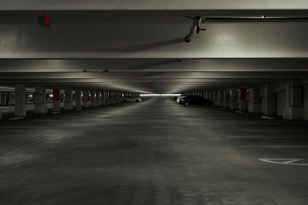 Quiet multi storey car park deck with marked bays, the kind of boundary a landowner authority has to map accurately